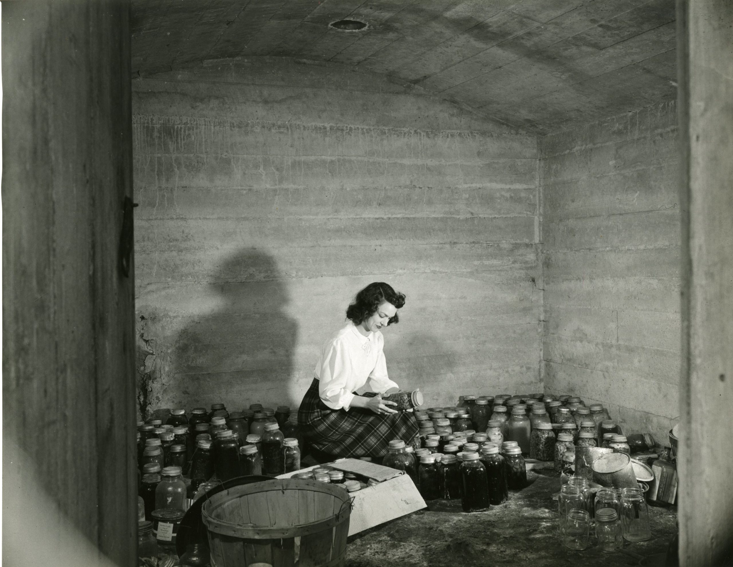 A student holding a jar in the cannery