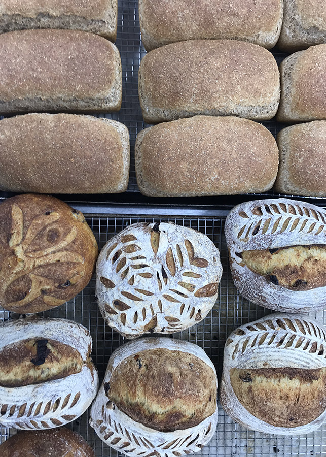 Freshly baked breads with intricate designs